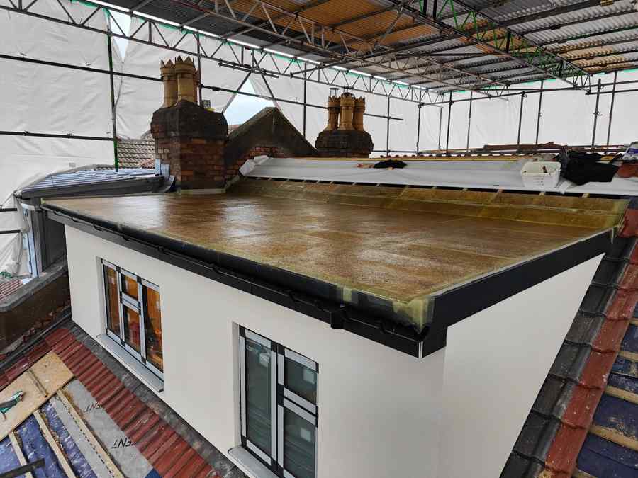 GRP flat roof on new extension under scaffold